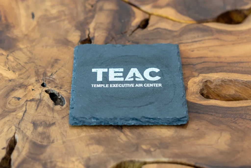 Drink Coaster with the TEAC logo on it
